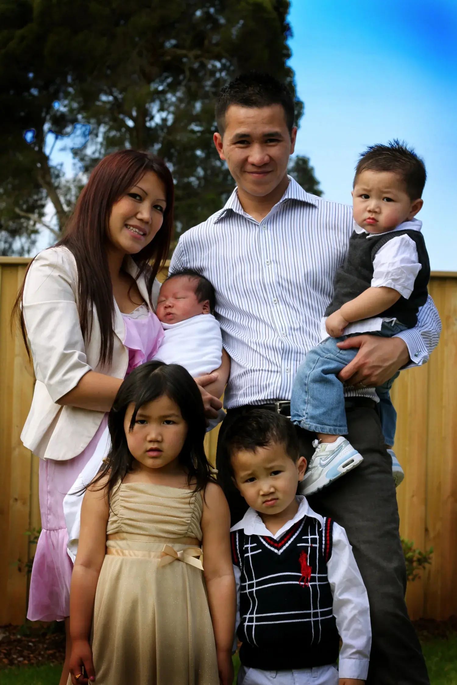 Tony Hoang with his wife and children
